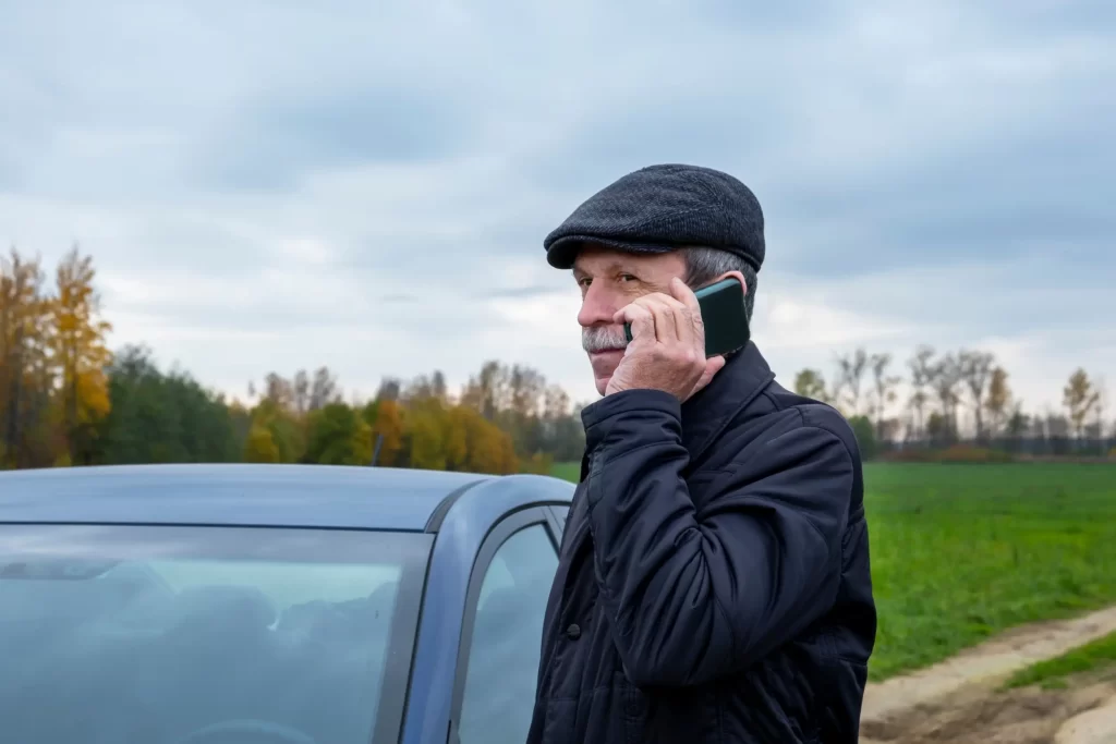 A person using a mobile phone to call for a fuel delivery service.